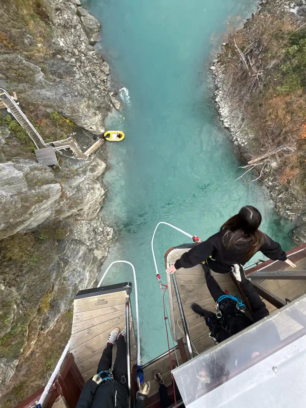 A jumper leaving the platform seen from above, boat waiting below