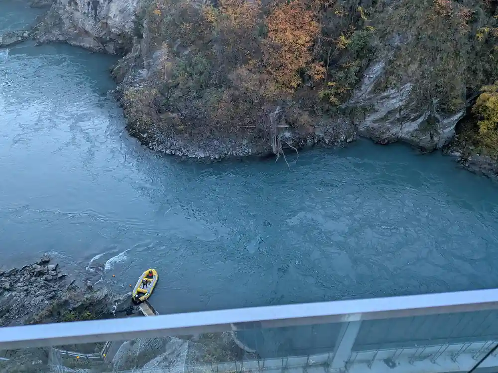 The river and the retrieval boat seen from the bridge deck
